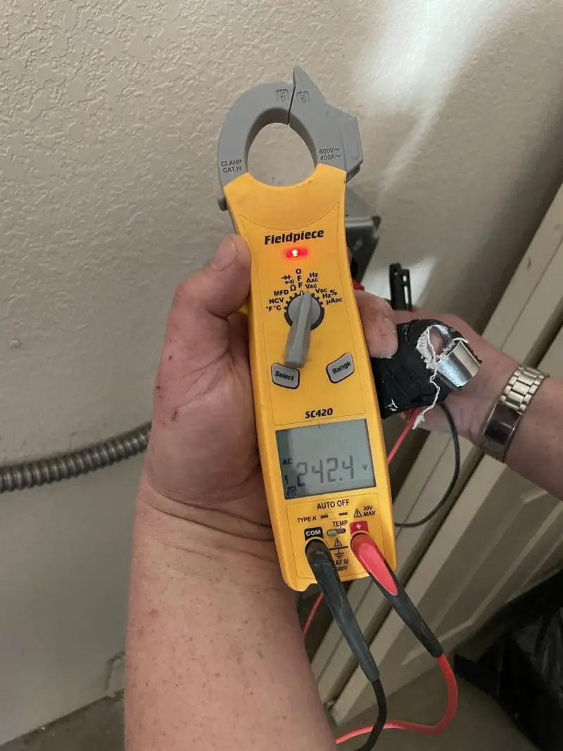 Voltage testing with clamp meter during Outlet Installation in Bellville